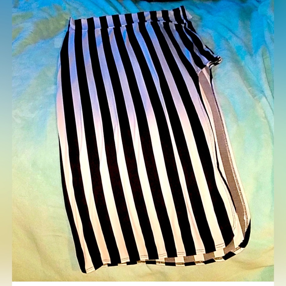 Black and white striped long skirt with high slit.